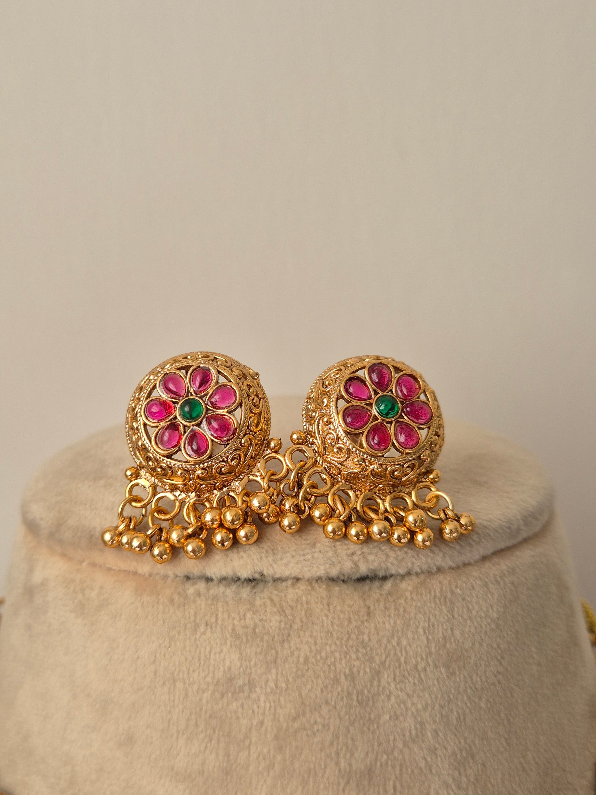 Vintage-style floral earrings, featuring fine flower wirework and a polished earrings with hanging golden beads by naitri.in