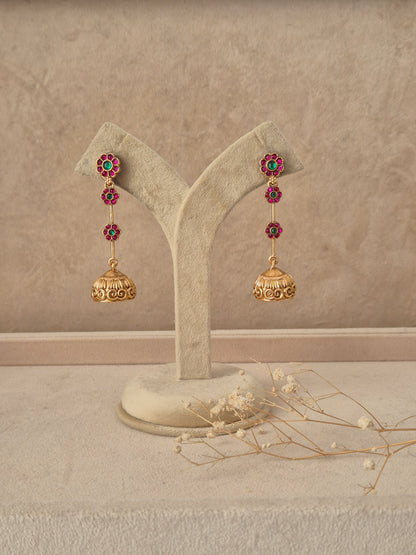 – traditional gold-plated long ethnic jhumka earrings with stone detailing by Naitri.in