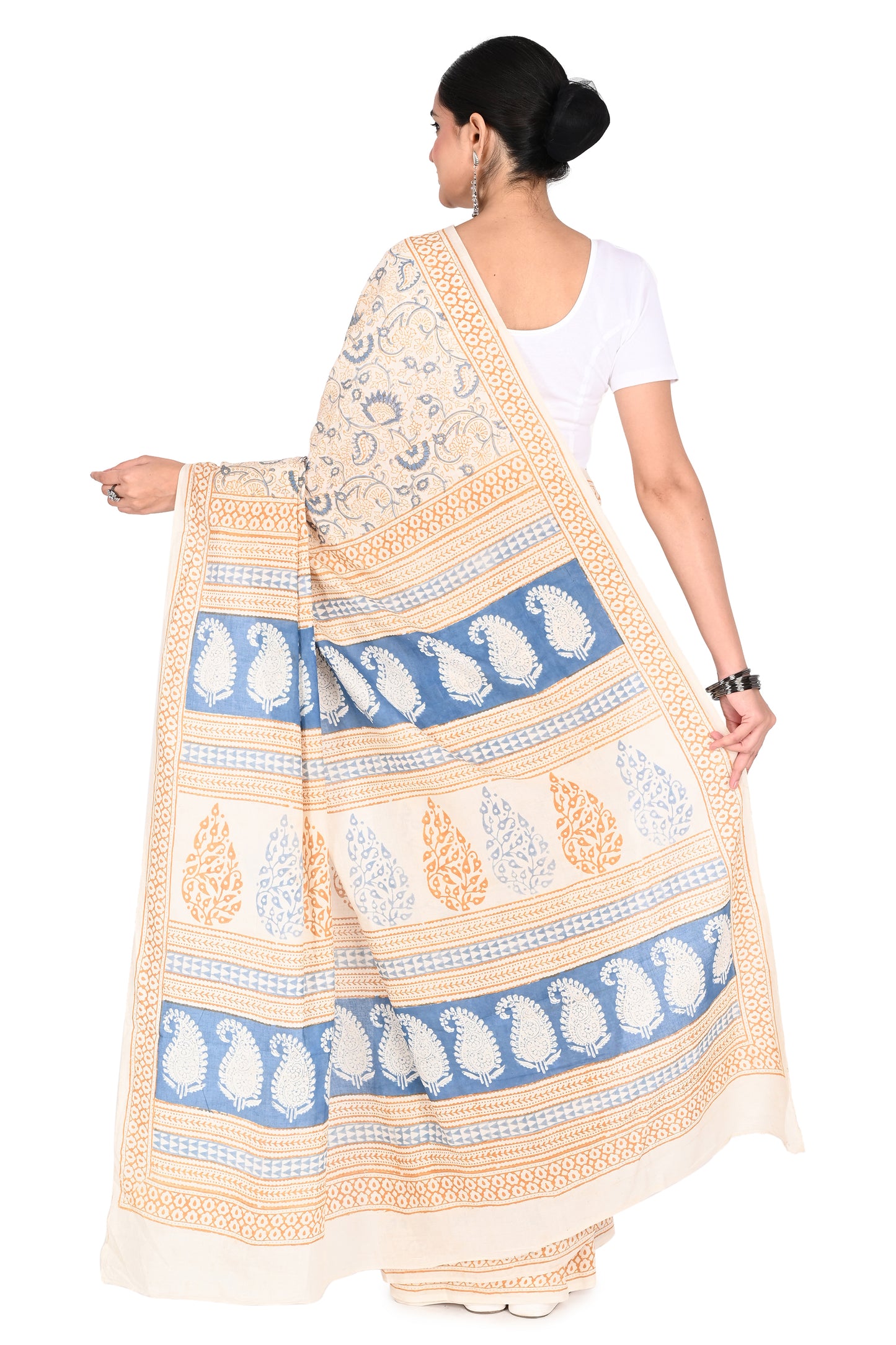 Elegant white and blue Padmaja cotton saree paired with a white short-sleeved blouse and silver earrings for a traditional Indian look by naitri.in