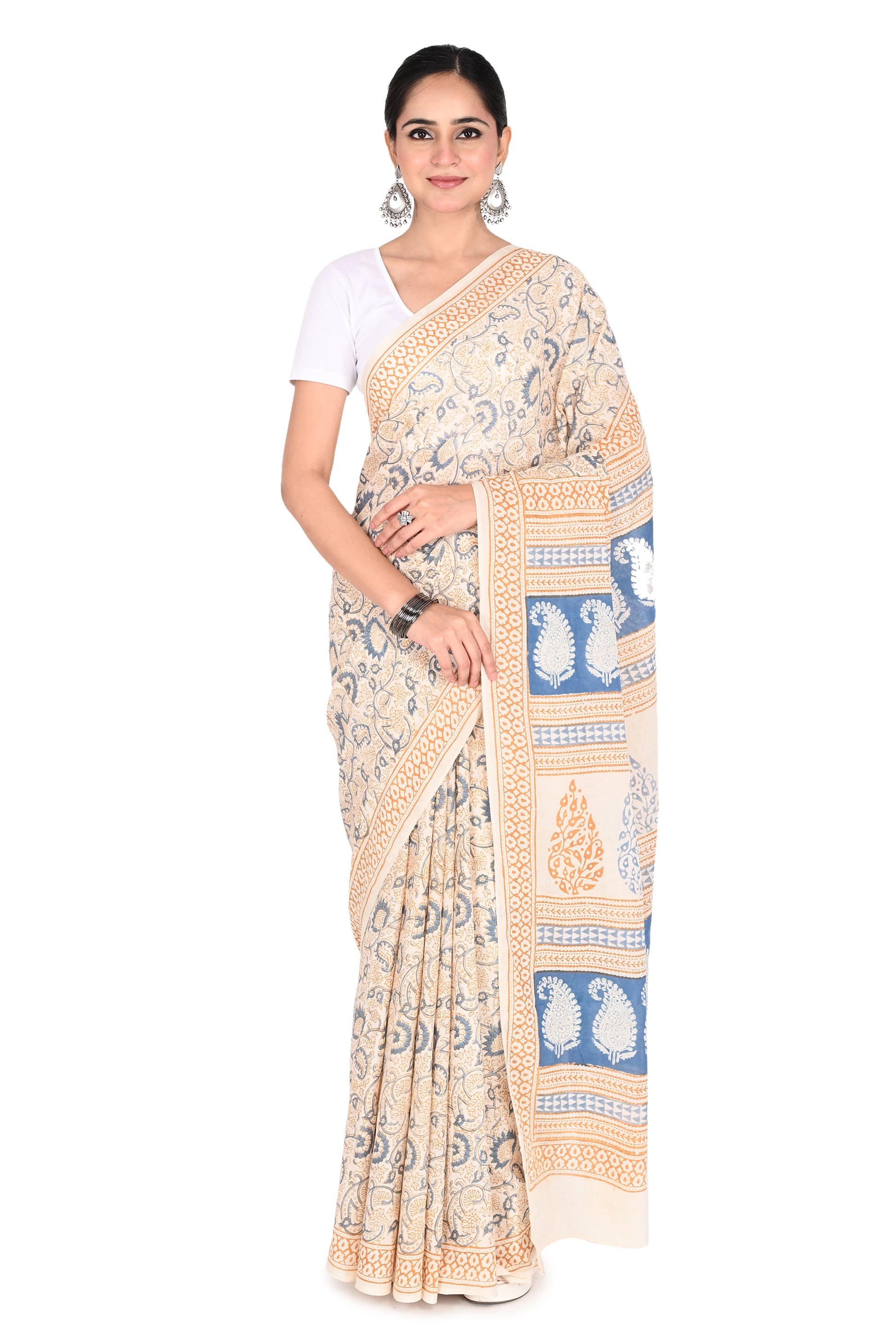 Woman wearing the Padmaja hand block printed cotton saree in white with blue floral motifs and a beige border by naitri.in