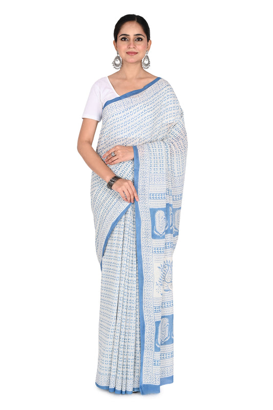 Woman modeling the Pari Hand Block Printed Cotton Saree, a white and blue breathable cotton saree featuring traditional Bagh geometric patterns and a classic drape by naitri.in