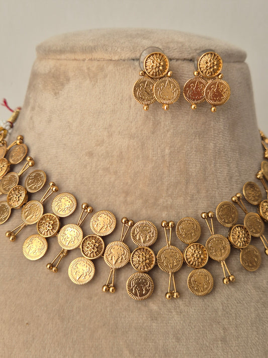 Traditional Indian Pooja necklace set with 3-layered coin-shaped gold charms, and matching stud-style earrings by naitri.in