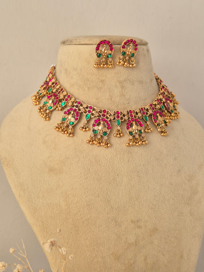 Close-up of a traditional Indian choker necklace set with colorful stones by Naitri.in