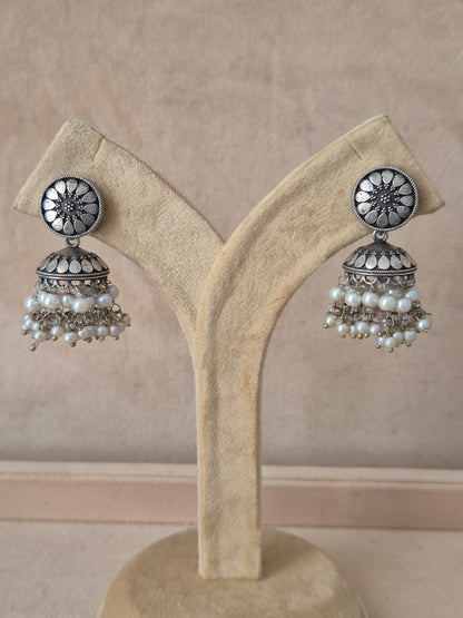 Naitri premium Paro oxidized silver jhumka earrings from the Silver Jewellery collection, Handcrafted silver oxidized drop earrings with detailed jhumka bells and delicate pearl beads by naitri.in