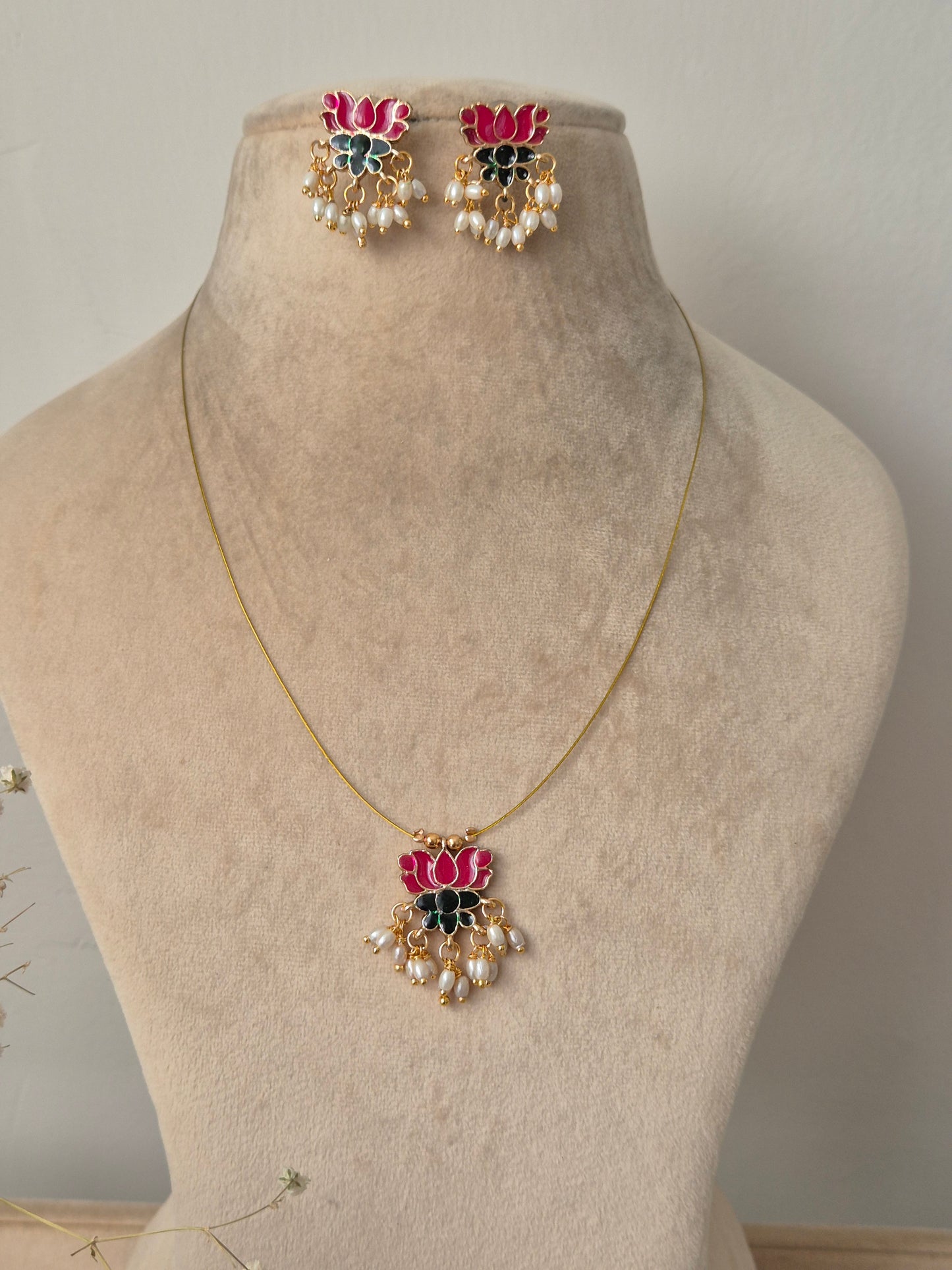 Necklace with pink lotus  and green leaf design invisible chain light weight elegant and minimal jewellery set by naitri