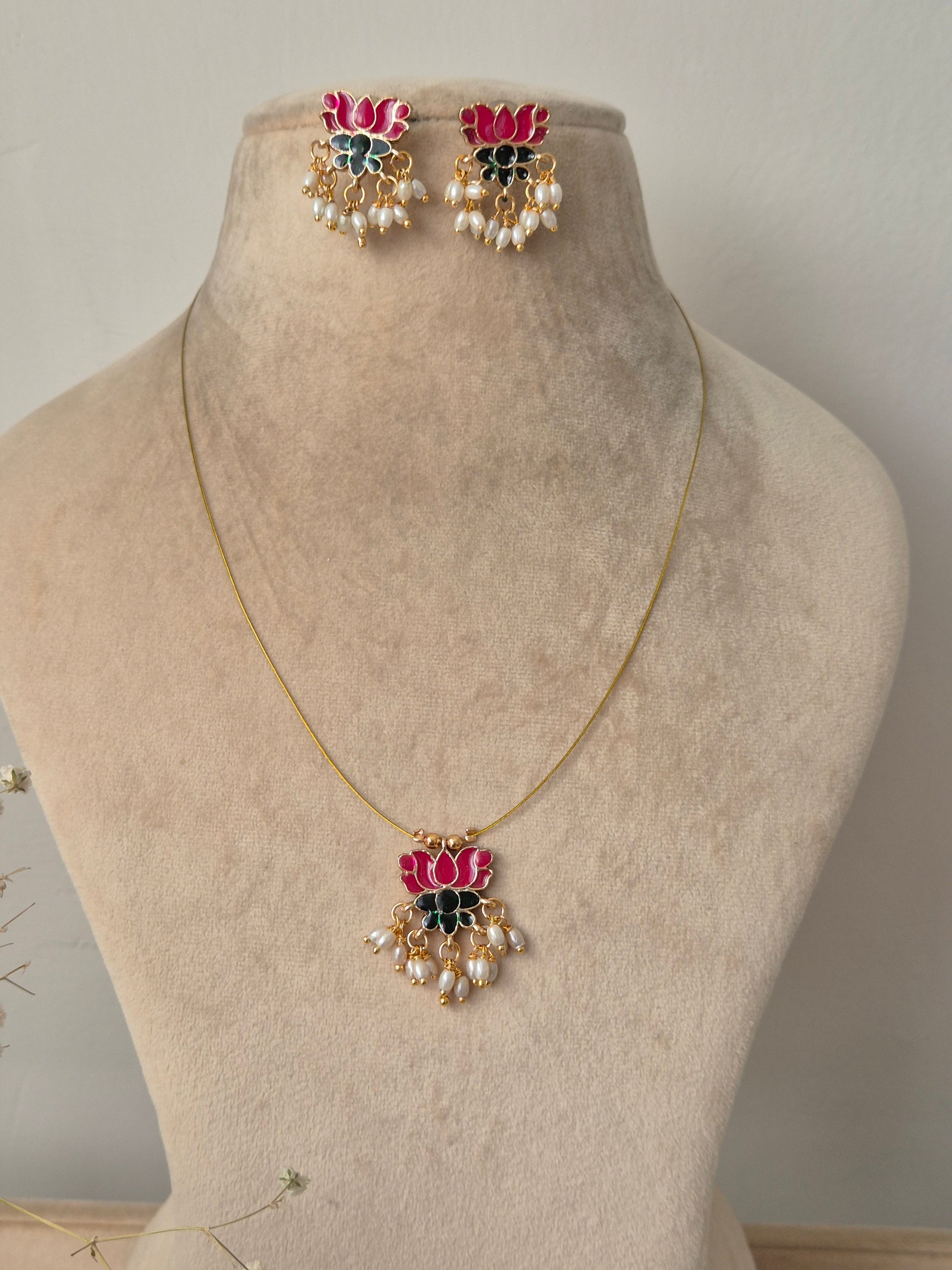 Necklace with pink lotus  and green leaf design invisible chain light weight elegant and minimal jewellery set by naitri