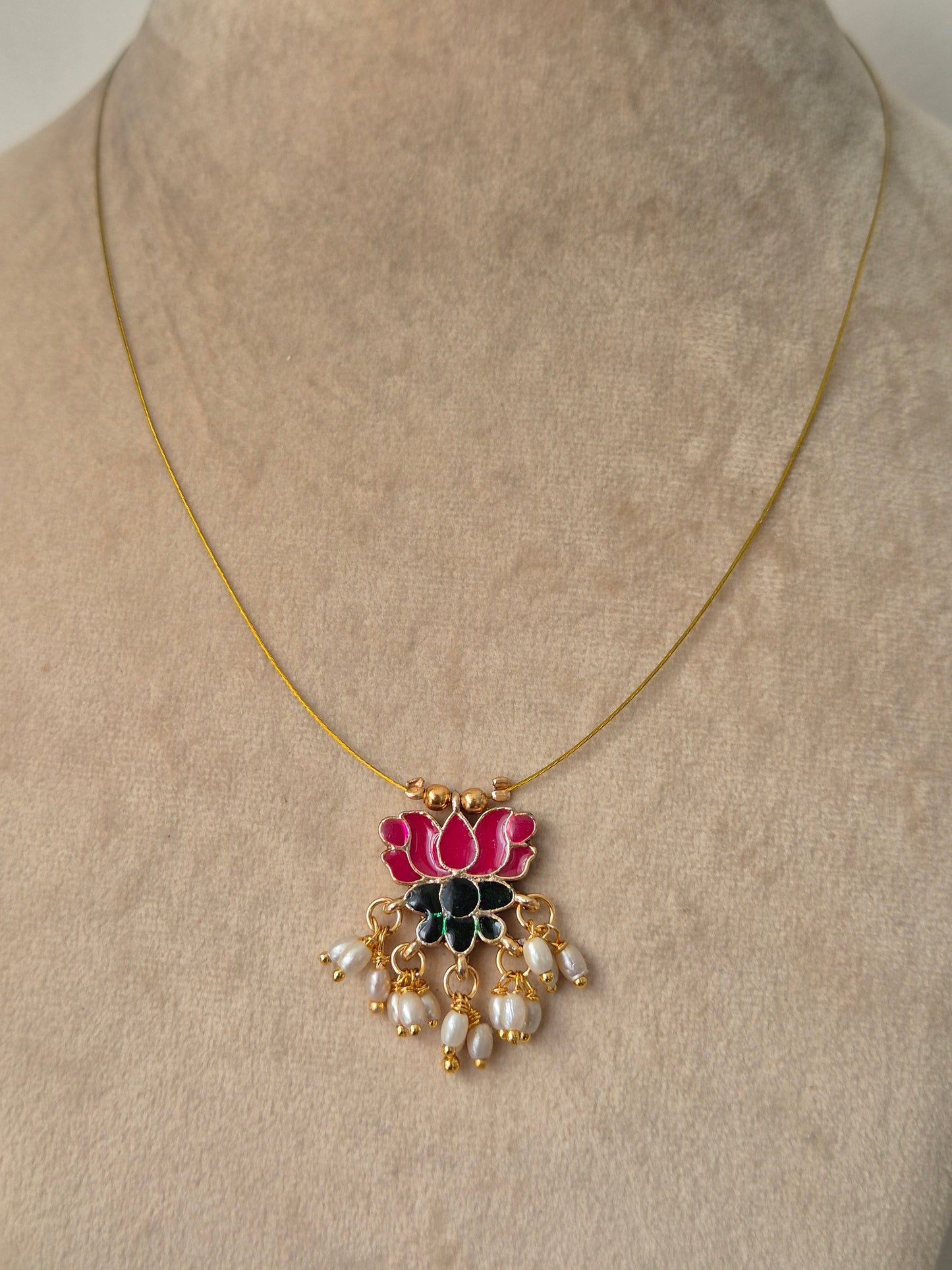 Gold plated necklace with pink lotus, golden beads and some small pearls, hanging from lotus pendant Timeless, High-quality by naitri.in