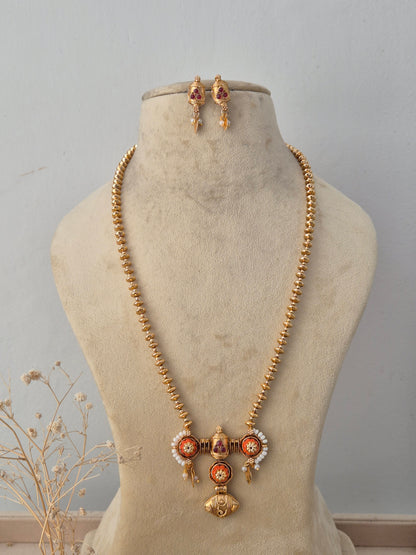 Pavitra Necklace Set featuring a traditional gold mangalsutra-style black beaded chain with an intricate temple pendant and matching earrings by Naitri.in