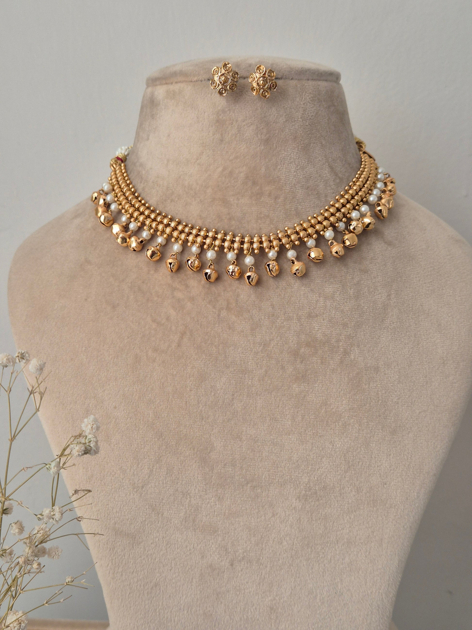 Gold necklace and earring stud pearls ghungroo beads with small white pearls necklace by naitri.in