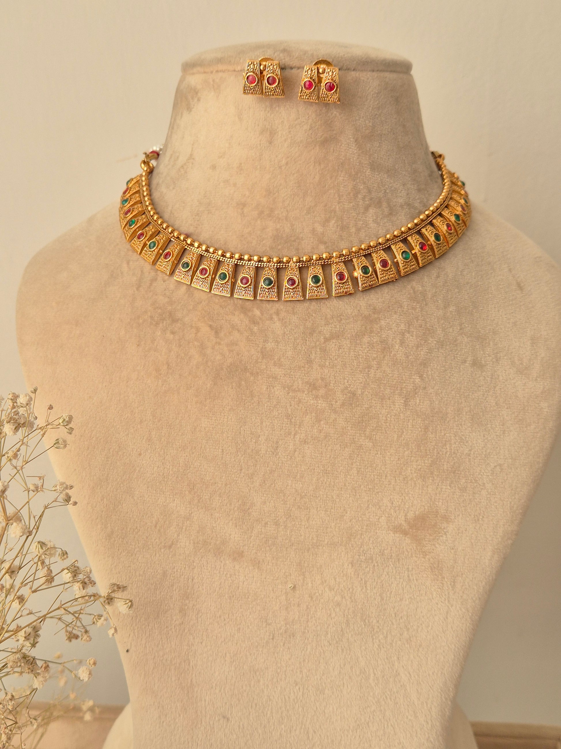 Gold necklace with green-red stones necklace traditional design by naitri.in