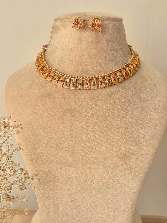 Gold necklace with green-red stones necklace traditional design by naitri.in