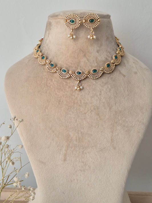 Gold necklace with green stones necklace traditional design by naitri.in