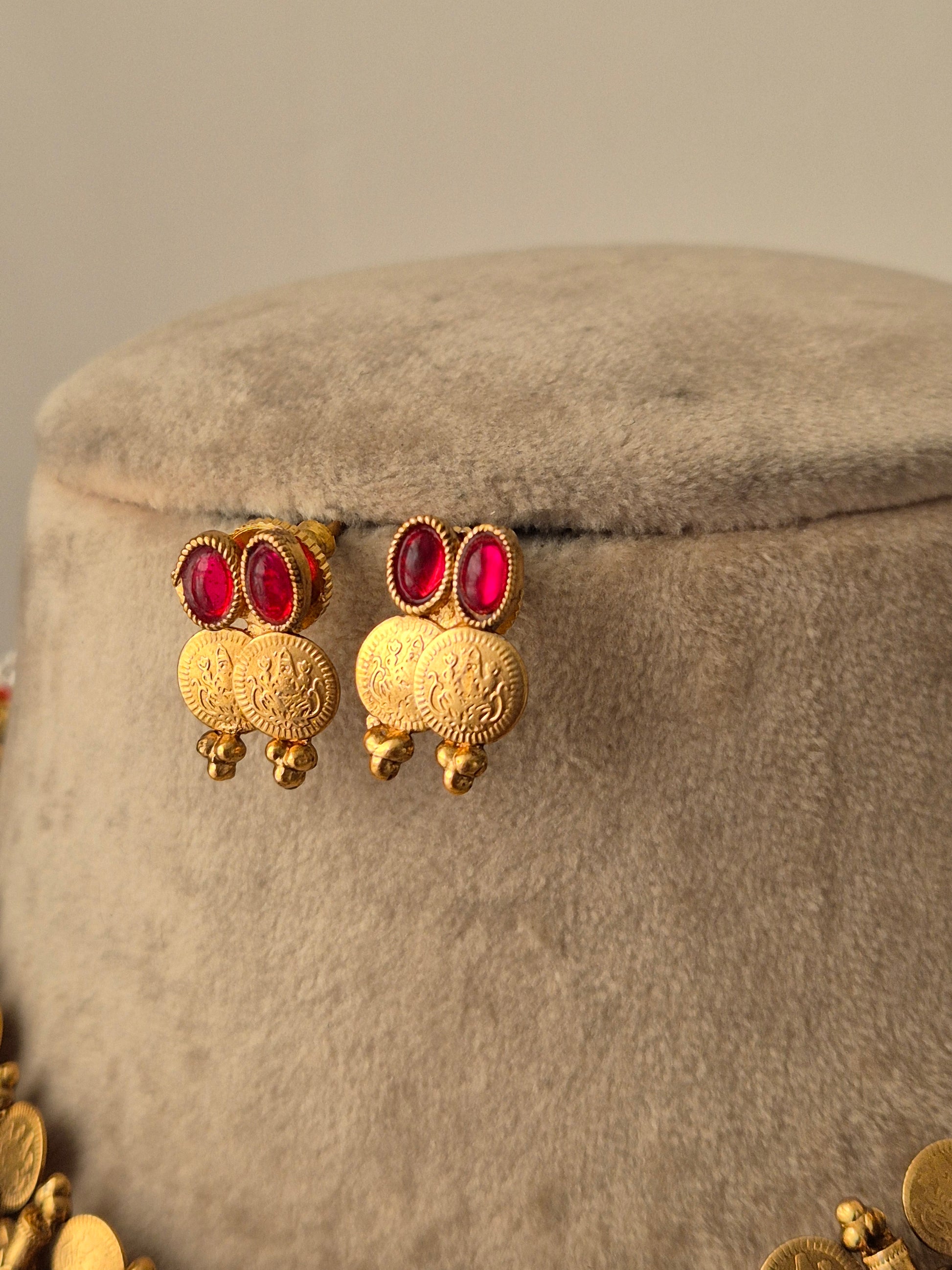 Gold earrings with red gemstones, coin-shaped gold charms, handcrafted gold-plated by naitri.in