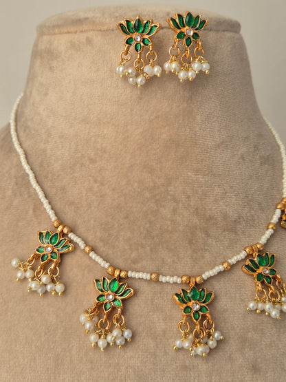 Jewelry set with green and gold elements with Pair of gold earrings with green leaves and white pearls by naitri.in