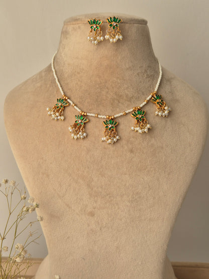 Gold and green jewelry set with beaded chain by naitri.in
