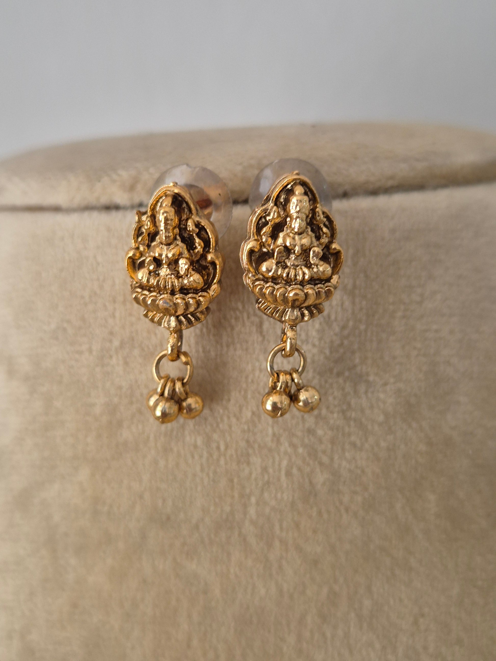 Gold-plated temple pendant earrings with gold hanging pearls by naitri.in