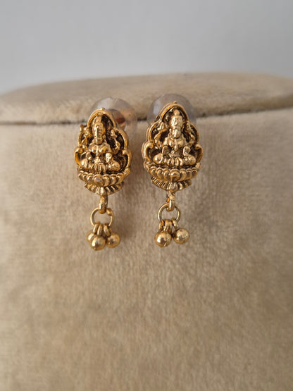 Gold-plated temple pendant earrings with gold hanging pearls by naitri.in