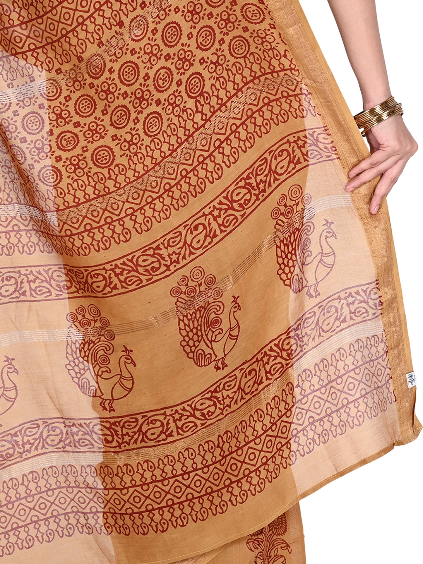 full-length view of a beige cotton-silk saree featuring intricate maroon geometric and floral block prints, showcasing the elegant drape and subtle silk sheen pallu  by naitri.in