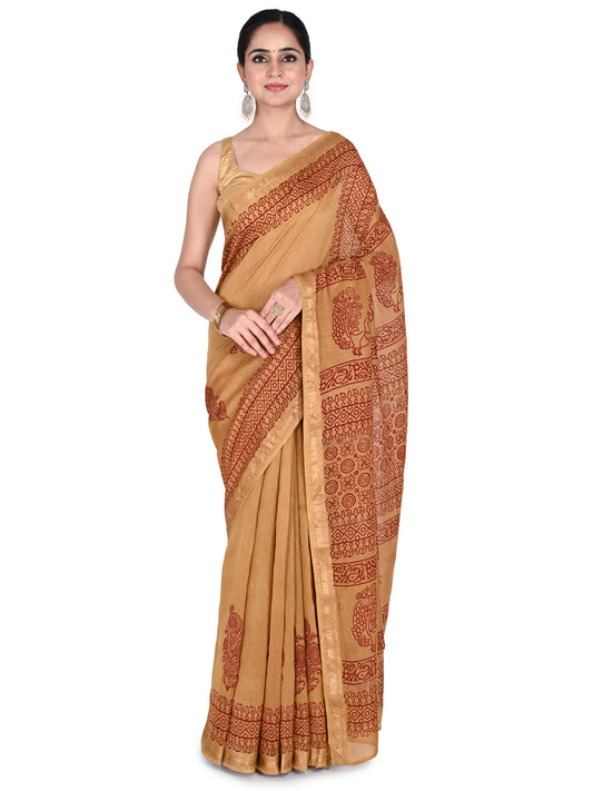 A model wearing a beige Rajeshwari cotton-silk saree with maroon hand-block printed floral patterns and a gold border, paired with a sleeveless gold blouse by naitri.in