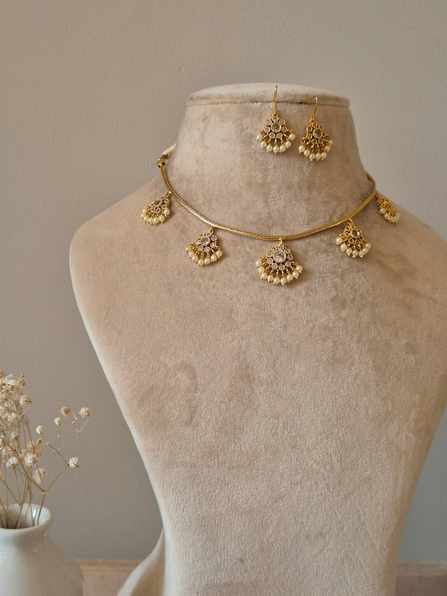 gold-plated necklace set with five fan-shaped stone-studded pendants and matching pearl-drop earrings for ethnic wear by naitri.in