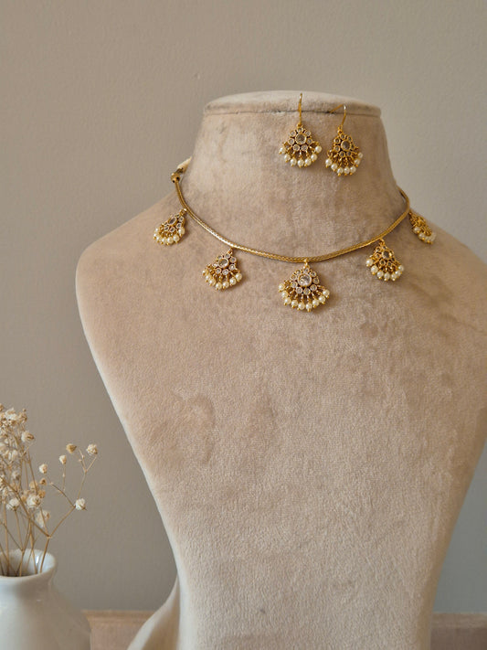 gold-plated necklace set with five fan-shaped stone-studded pendants and matching pearl-drop earrings for ethnic wear by naitri.in