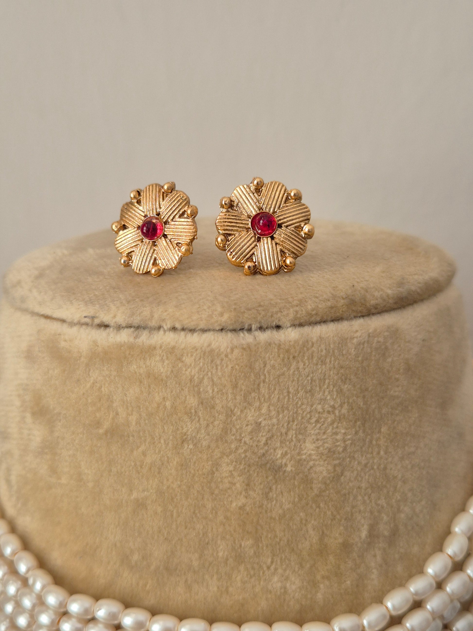 Gold-polished with red stone embellishments earrings by naitri.in