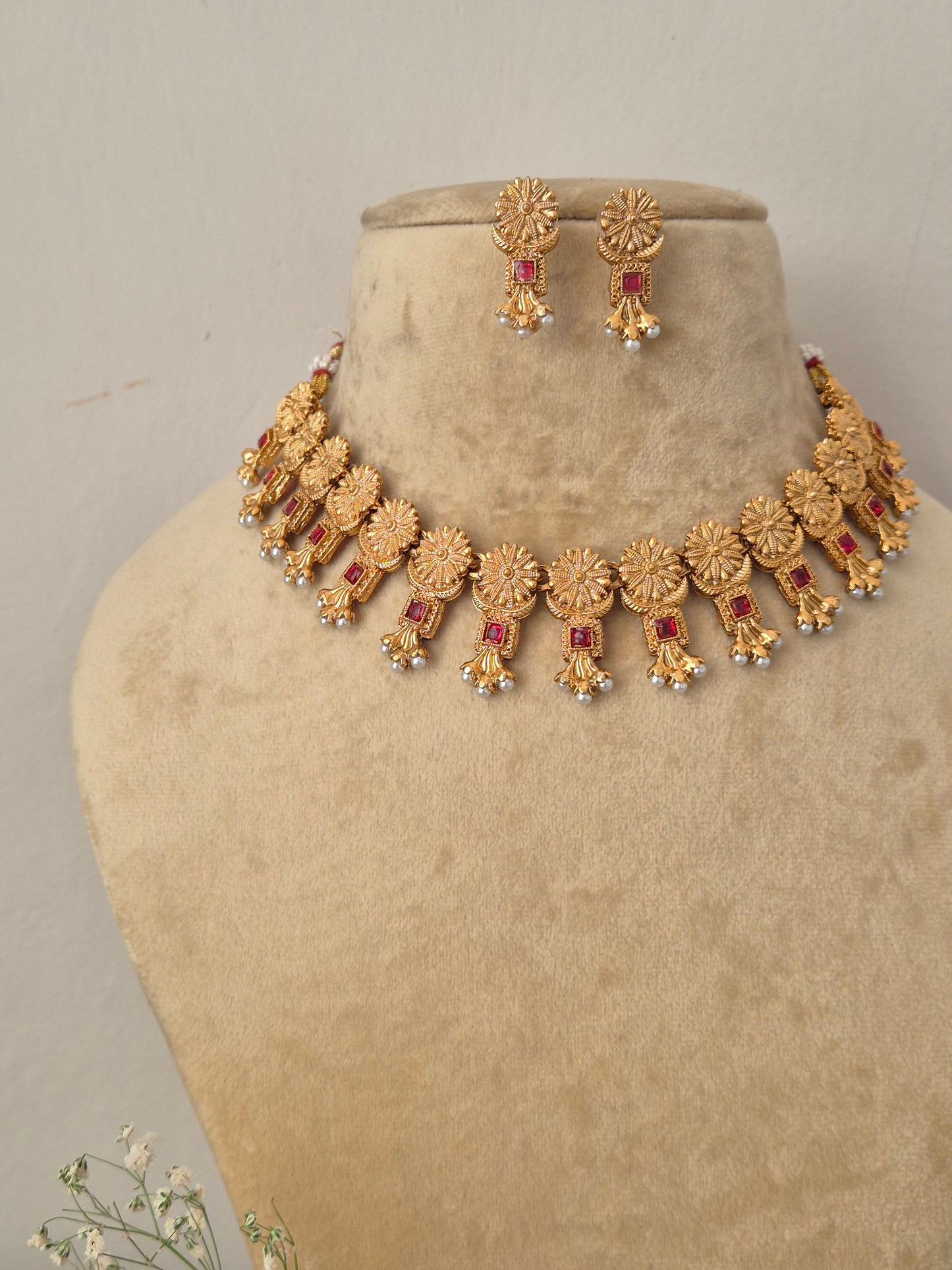 Ornate hand-crafted antique gold statement necklace and earring set, Traditional Indian style golden brass alloy choker necklace and earrings set from the NAITRI jewellery collection by naitri.in 
