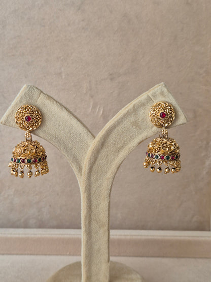 Traditional golden Jhumka earrings with colorful stone accents by naitri.in