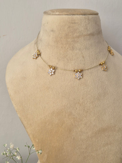 Modern Indian style delicate golden brass alloy pendant necklace, Handcrafted delicate gold invisible  chain with floral crystal drops, by naitri.in