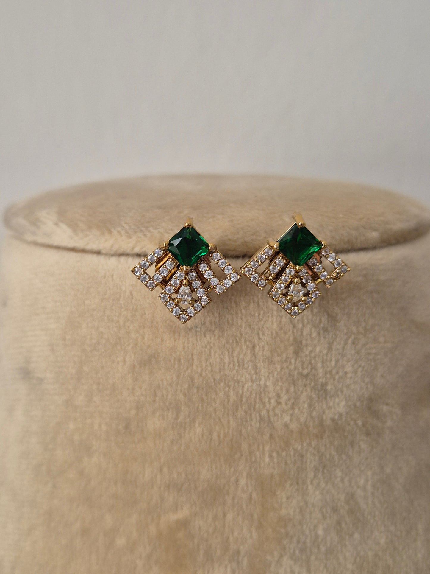 fan-shaped geometric charms accented with emerald-green gemstones and clear crystals, earring by naitri.in