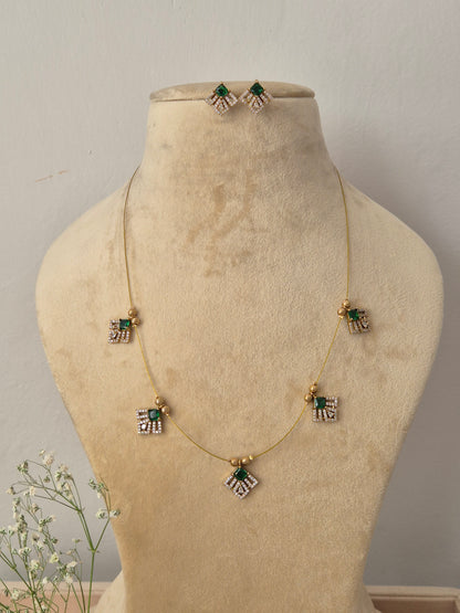 Delicate gold invisible chain necklace with hanging geometric pendants and matching earrings, by naitri.in
