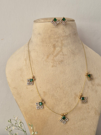 Handcrafted delicate gold chain choker set with geometric crystal and green stone drops, Modern Indian style delicate golden brass alloy pendant necklace by naitri.in