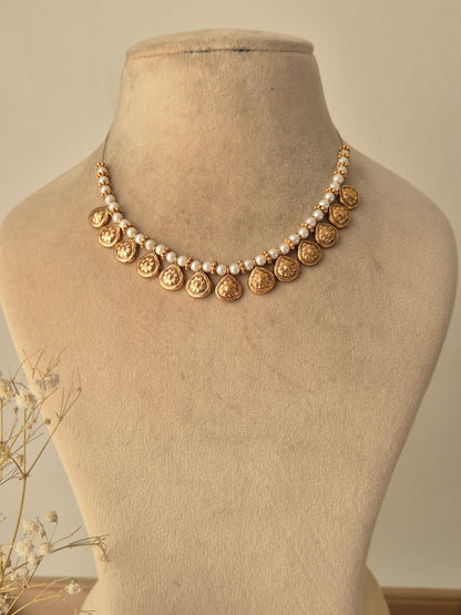 Traditional Indian necklace with small Pearls chain, coin-shaped gold charms between pearls by naitri.in