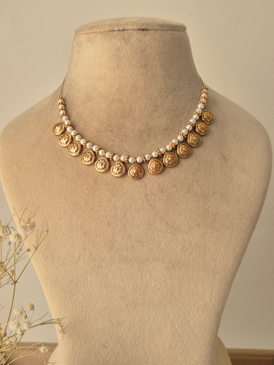 Traditional Indian necklace with small Pearls chain, coin-shaped gold charms between pearls by naitri.in