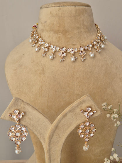 American Diamond Necklace Set with floral motifs and white pearl drops on a rose-gold toned alloy base by Naitri.in