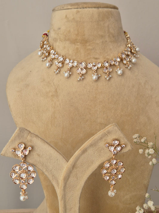 American Diamond Necklace Set with floral motifs and white pearl drops on a rose-gold toned alloy base by Naitri.in