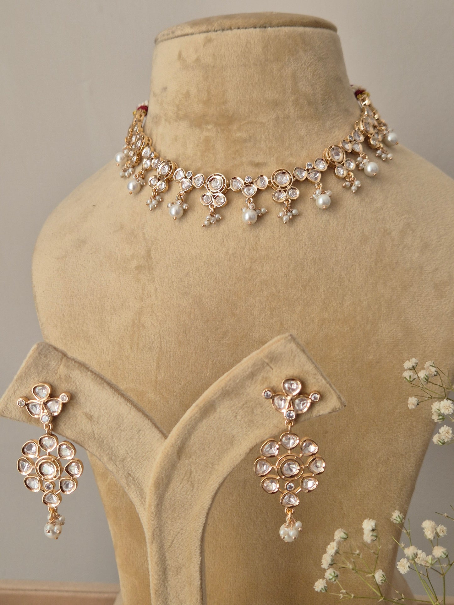 Elegant gold-plated American diamond necklace set with petite pearl hangings for a sophisticated festive look by naitri.in