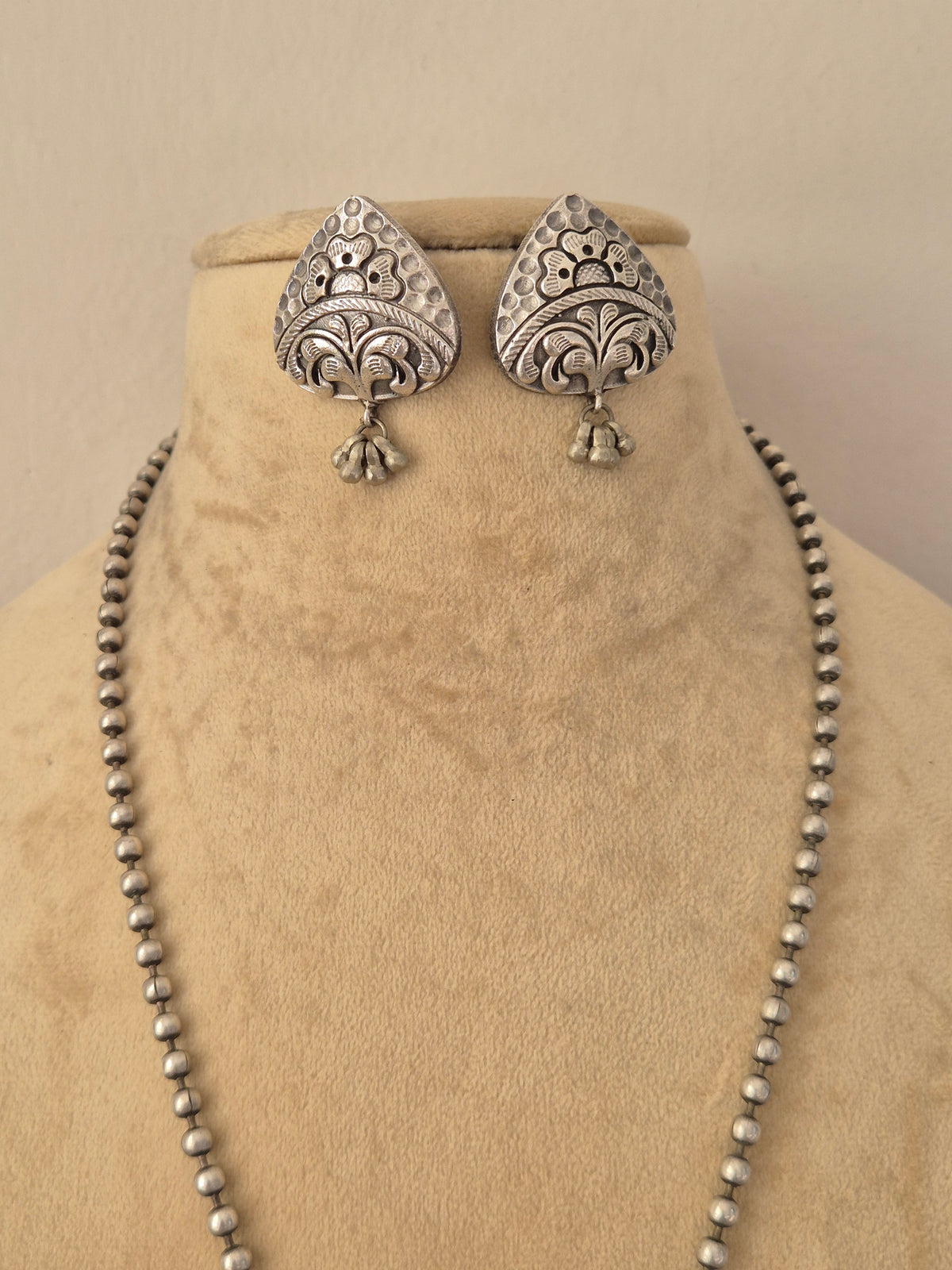 oxidized silver teardrop earrings intricately carved geometric earrings featuring dangling bead charms, by naitri.in