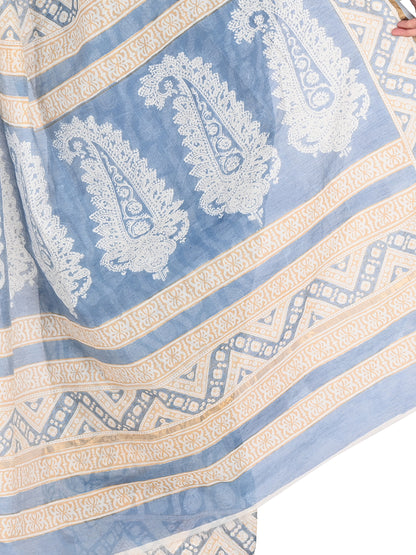 Close-up shot of the soft cotton silk fabric texture and gold border of the beige Rini Maheshwari hand-blocked saree by naitri.in