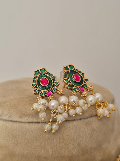 gold-toned earring set with pink and green stones and pearl hangings by naitri.in