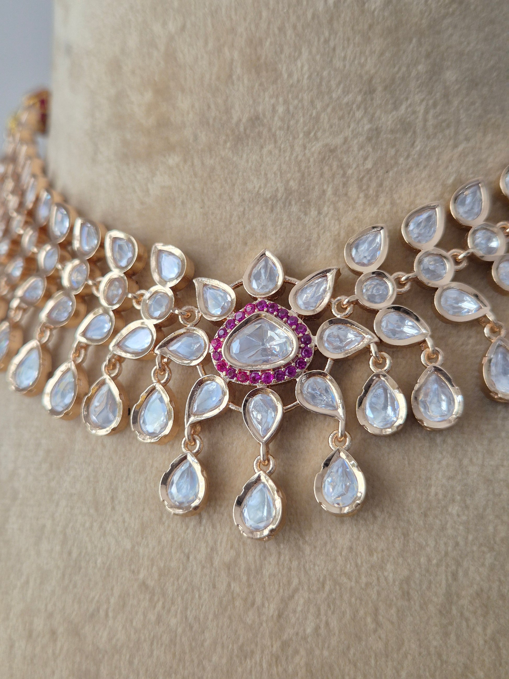 Modern Indian Rosalie necklace set with shimmering AD stones and ruby-red centers by naitri.in