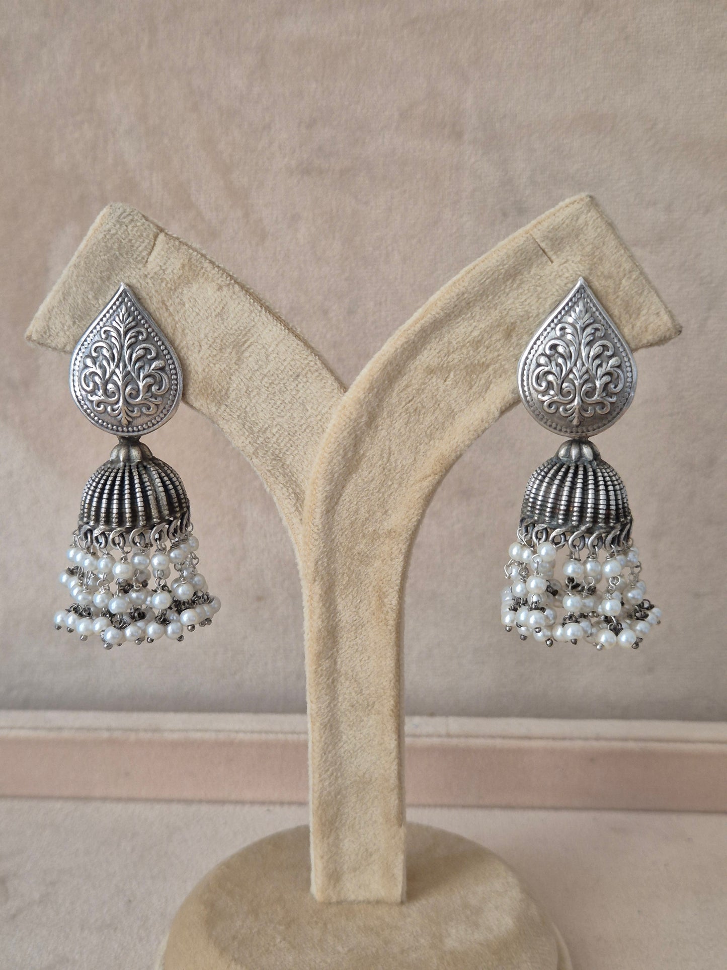 Naitri premium Sagarika silver oxidized dangle jhumka earrings from the Silver Jewellery collection,  Handcrafted oxidized silver-toned jhumka earrings featuring delicate pearl bead clusters by naitri.in