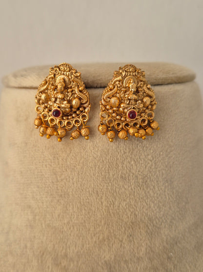 Traditional Indian ethnic gold earring set with gemstone details by Naitri.in