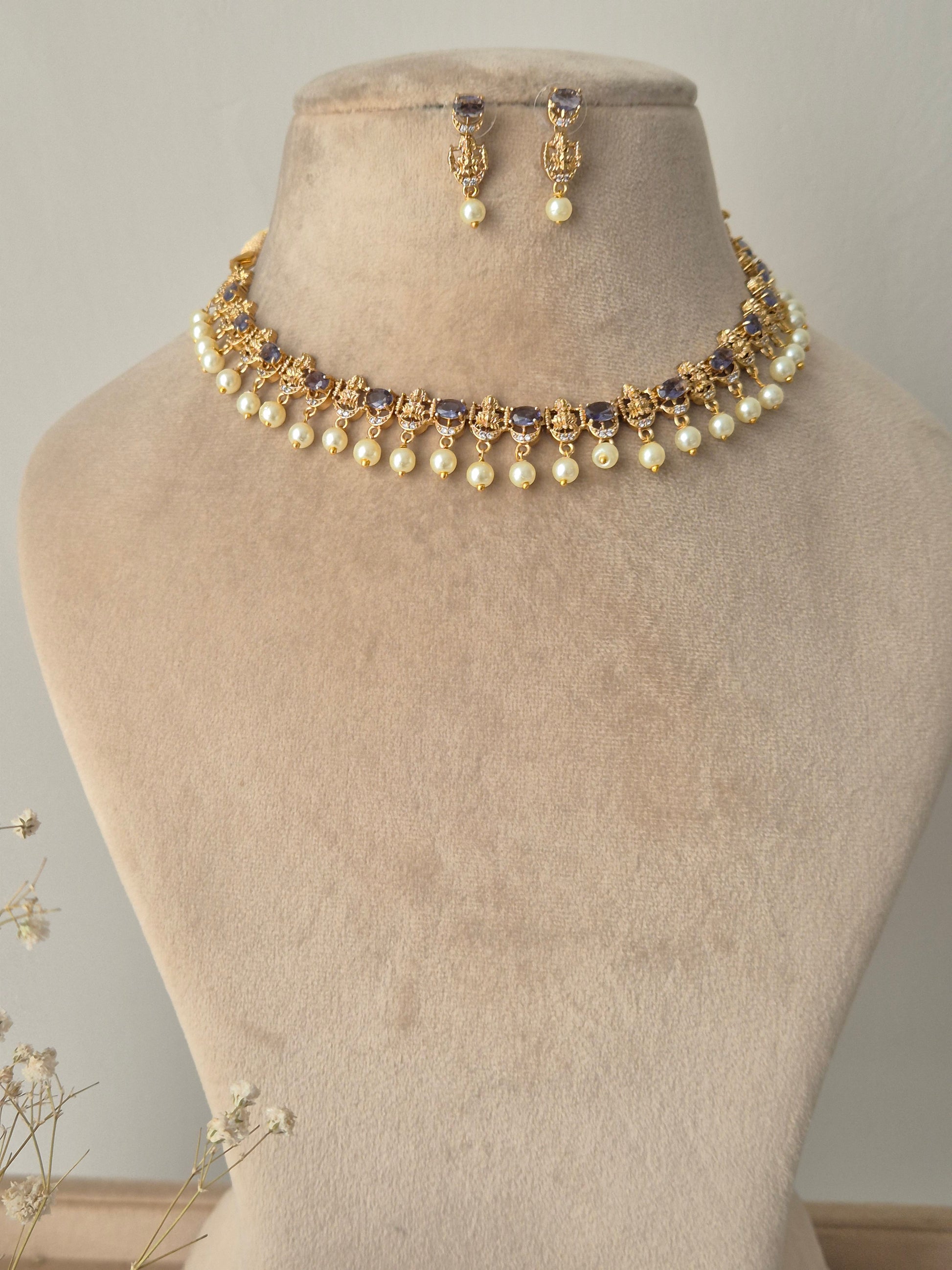 Necklace with pearls and gold accents with hanging pearls by naitri.in