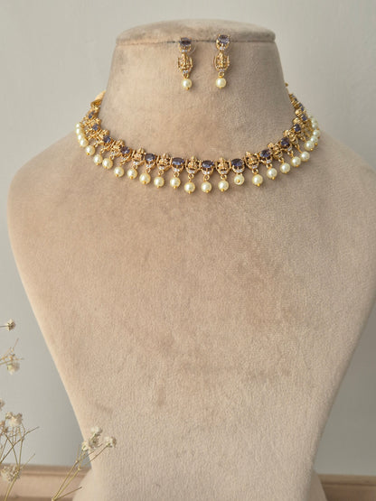 Necklace with pearls and gold accents with hanging pearls by naitri.in