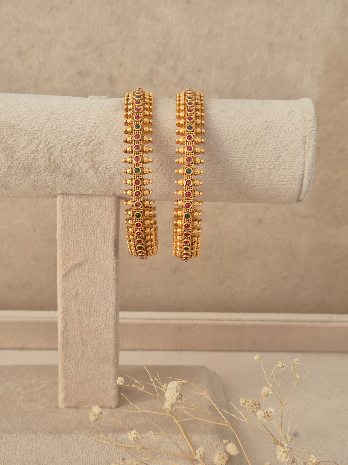 Set of 2 gold-plated bangles featuring a textured beaded mesh design with circular center accents by naitri.in