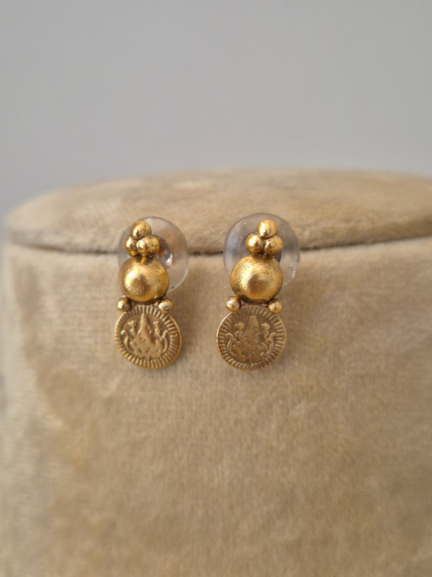 The Sapna earrings  by Naitri, a brass alloy matte gold earrings with coin details by naitri.in
