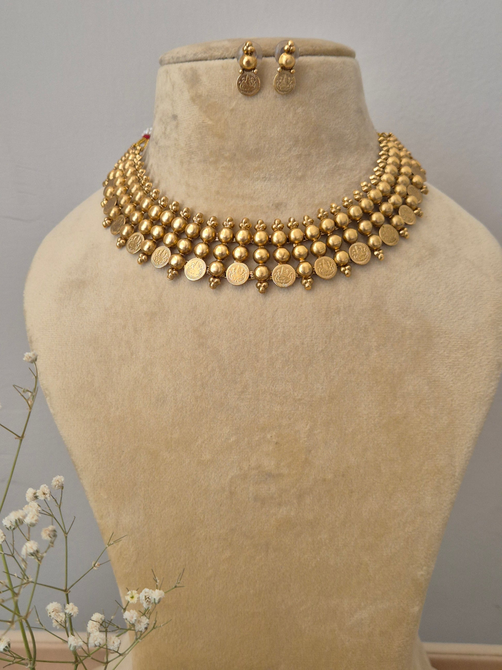 Gold-plated bead and coin choker necklace set with matching drop earrings by naitri.in