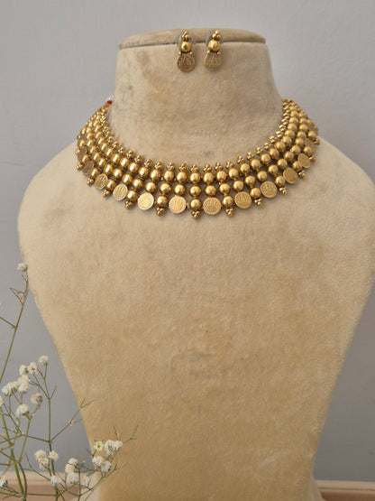 Gold-plated bead and coin choker necklace set with matching drop earrings by naitri.in
