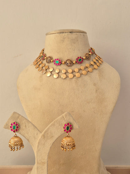 Traditional gold-plated layered choker necklace set with ruby and emerald-colored stone by Naitri.in